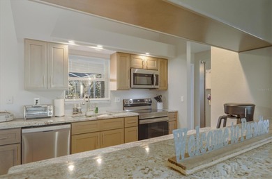 Don't miss out on this beautifully kept and tastefully updated on Pinemoor West Golf Club in Florida - for sale on GolfHomes.com, golf home, golf lot