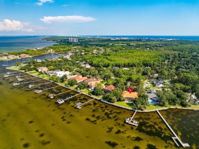 WESTWARD-FACING SINGLE-STORY WATERFRONT ESTATE WITHIN ESTEEMED on Kelly Plantation Golf Club in Florida - for sale on GolfHomes.com, golf home, golf lot