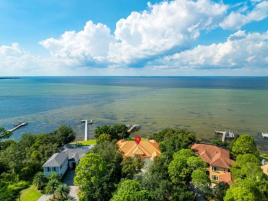 WESTWARD-FACING SINGLE-STORY WATERFRONT ESTATE WITHIN ESTEEMED on Kelly Plantation Golf Club in Florida - for sale on GolfHomes.com, golf home, golf lot