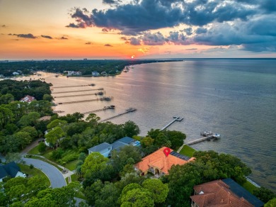 WESTWARD-FACING SINGLE-STORY WATERFRONT ESTATE WITHIN ESTEEMED on Kelly Plantation Golf Club in Florida - for sale on GolfHomes.com, golf home, golf lot