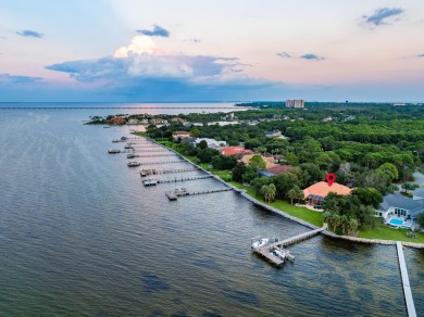 WESTWARD-FACING SINGLE-STORY WATERFRONT ESTATE WITHIN ESTEEMED on Kelly Plantation Golf Club in Florida - for sale on GolfHomes.com, golf home, golf lot