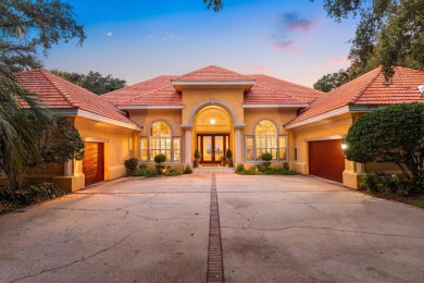 WESTWARD-FACING SINGLE-STORY WATERFRONT ESTATE WITHIN ESTEEMED on Kelly Plantation Golf Club in Florida - for sale on GolfHomes.com, golf home, golf lot