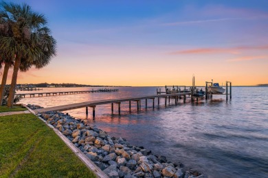 WESTWARD-FACING SINGLE-STORY WATERFRONT ESTATE WITHIN ESTEEMED on Kelly Plantation Golf Club in Florida - for sale on GolfHomes.com, golf home, golf lot