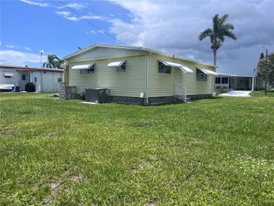 Come see this cheery yellow home, and enjoy sunny Florida living on Heather Hills Golf Course in Florida - for sale on GolfHomes.com, golf home, golf lot