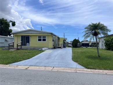 Come see this cheery yellow home, and enjoy sunny Florida living on Heather Hills Golf Course in Florida - for sale on GolfHomes.com, golf home, golf lot