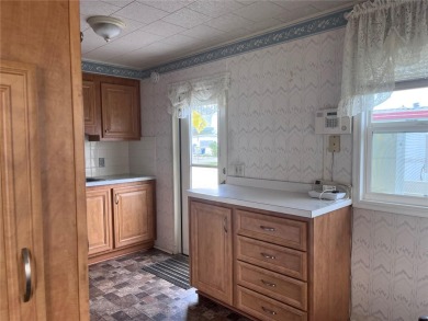 Come see this cheery yellow home, and enjoy sunny Florida living on Heather Hills Golf Course in Florida - for sale on GolfHomes.com, golf home, golf lot