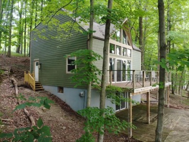 Beautifully brought back to life with tree top views on Treasure Lake - Gold in Pennsylvania - for sale on GolfHomes.com, golf home, golf lot