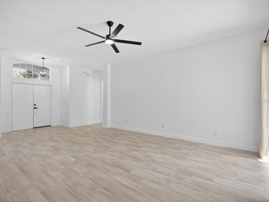 Located in a gated golf course community, 411 Boxwood Dr has on Ridgewood Lakes Golf and Country Club in Florida - for sale on GolfHomes.com, golf home, golf lot