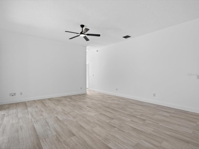 Located in a gated golf course community, 411 Boxwood Dr has on Ridgewood Lakes Golf and Country Club in Florida - for sale on GolfHomes.com, golf home, golf lot