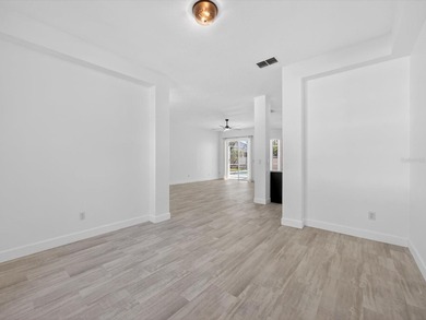 Located in a gated golf course community, 411 Boxwood Dr has on Ridgewood Lakes Golf and Country Club in Florida - for sale on GolfHomes.com, golf home, golf lot