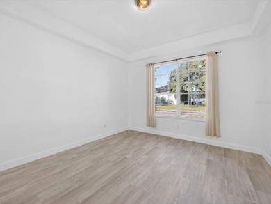 Located in a gated golf course community, 411 Boxwood Dr has on Ridgewood Lakes Golf and Country Club in Florida - for sale on GolfHomes.com, golf home, golf lot