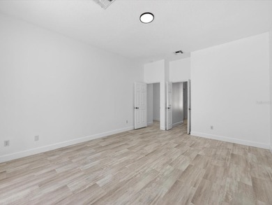 Located in a gated golf course community, 411 Boxwood Dr has on Ridgewood Lakes Golf and Country Club in Florida - for sale on GolfHomes.com, golf home, golf lot