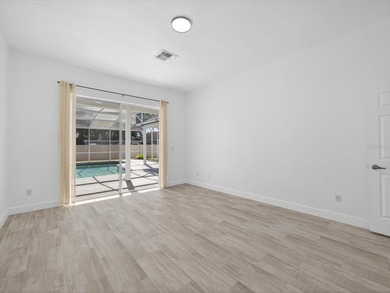 Located in a gated golf course community, 411 Boxwood Dr has on Ridgewood Lakes Golf and Country Club in Florida - for sale on GolfHomes.com, golf home, golf lot