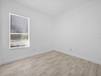 Located in a gated golf course community, 411 Boxwood Dr has on Ridgewood Lakes Golf and Country Club in Florida - for sale on GolfHomes.com, golf home, golf lot