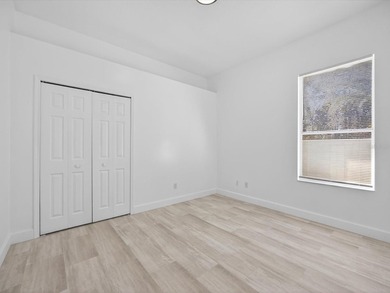 Located in a gated golf course community, 411 Boxwood Dr has on Ridgewood Lakes Golf and Country Club in Florida - for sale on GolfHomes.com, golf home, golf lot