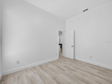 Located in a gated golf course community, 411 Boxwood Dr has on Ridgewood Lakes Golf and Country Club in Florida - for sale on GolfHomes.com, golf home, golf lot