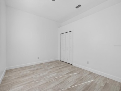 Located in a gated golf course community, 411 Boxwood Dr has on Ridgewood Lakes Golf and Country Club in Florida - for sale on GolfHomes.com, golf home, golf lot