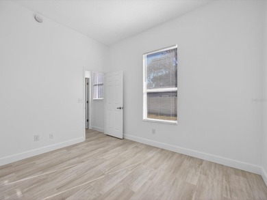 Located in a gated golf course community, 411 Boxwood Dr has on Ridgewood Lakes Golf and Country Club in Florida - for sale on GolfHomes.com, golf home, golf lot