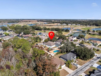 Located in a gated golf course community, 411 Boxwood Dr has on Ridgewood Lakes Golf and Country Club in Florida - for sale on GolfHomes.com, golf home, golf lot