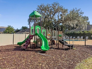 Located in a gated golf course community, 411 Boxwood Dr has on Ridgewood Lakes Golf and Country Club in Florida - for sale on GolfHomes.com, golf home, golf lot