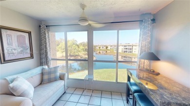 Open the front door to a stunning long lake view!  This is a on Sunrise Lakes Phase III in Florida - for sale on GolfHomes.com, golf home, golf lot