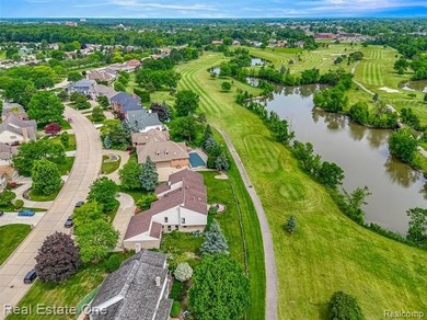 Experience refined contemporary living in this exquisite on Riverview Highlands Golf Club  in Michigan - for sale on GolfHomes.com, golf home, golf lot