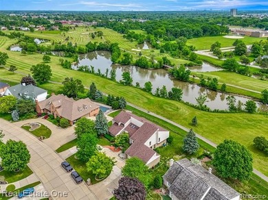 Experience refined contemporary living in this exquisite on Riverview Highlands Golf Club  in Michigan - for sale on GolfHomes.com, golf home, golf lot