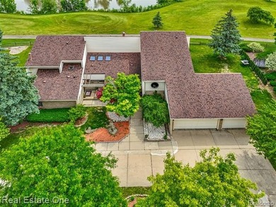 Experience refined contemporary living in this exquisite on Riverview Highlands Golf Club  in Michigan - for sale on GolfHomes.com, golf home, golf lot