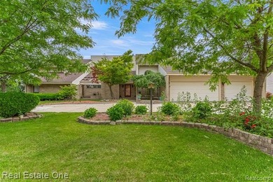 Experience refined contemporary living in this exquisite on Riverview Highlands Golf Club  in Michigan - for sale on GolfHomes.com, golf home, golf lot