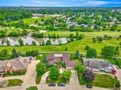 Experience refined contemporary living in this exquisite on Riverview Highlands Golf Club  in Michigan - for sale on GolfHomes.com, golf home, golf lot