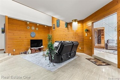 Experience refined contemporary living in this exquisite on Riverview Highlands Golf Club  in Michigan - for sale on GolfHomes.com, golf home, golf lot