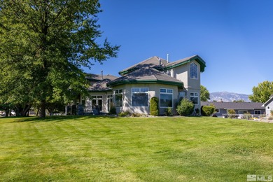 Nestled on a lush 1-acre lot along the scenic Carson Valley Golf on Carson Valley Golf Course in Nevada - for sale on GolfHomes.com, golf home, golf lot