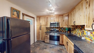 Beautifully brought back to life with tree top views on Treasure Lake - Gold in Pennsylvania - for sale on GolfHomes.com, golf home, golf lot