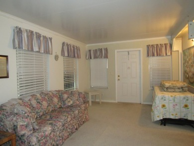 2005 Palm Harbor mobile home with a large (12x20) Florida room on Spanish Lakes Golf Village in Florida - for sale on GolfHomes.com, golf home, golf lot