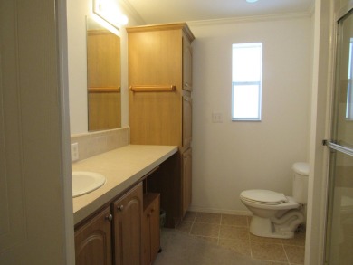 2005 Palm Harbor mobile home with a large (12x20) Florida room on Spanish Lakes Golf Village in Florida - for sale on GolfHomes.com, golf home, golf lot