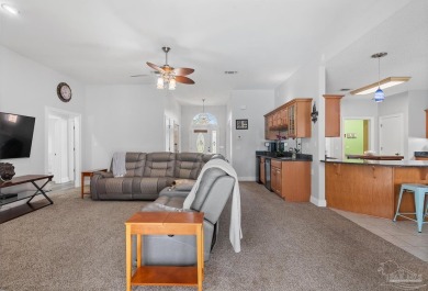 Welcome to your dream home at 3849 Saber Tooth Circle, nestled on Tiger Point Golf and Country Club in Florida - for sale on GolfHomes.com, golf home, golf lot