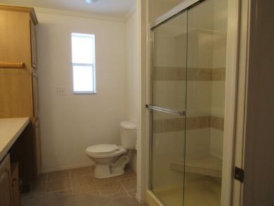 2005 Palm Harbor mobile home with a large (12x20) Florida room on Spanish Lakes Golf Village in Florida - for sale on GolfHomes.com, golf home, golf lot