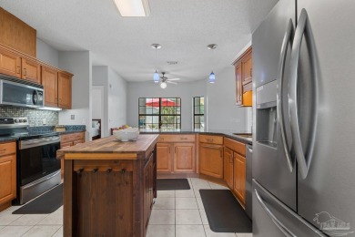 Welcome to your dream home at 3849 Saber Tooth Circle, nestled on Tiger Point Golf and Country Club in Florida - for sale on GolfHomes.com, golf home, golf lot