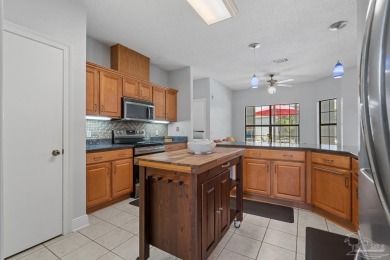 Welcome to your dream home at 3849 Saber Tooth Circle, nestled on Tiger Point Golf and Country Club in Florida - for sale on GolfHomes.com, golf home, golf lot