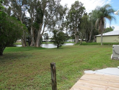 2005 Palm Harbor mobile home with a large (12x20) Florida room on Spanish Lakes Golf Village in Florida - for sale on GolfHomes.com, golf home, golf lot