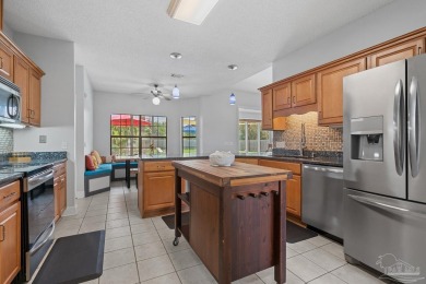 Welcome to your dream home at 3849 Saber Tooth Circle, nestled on Tiger Point Golf and Country Club in Florida - for sale on GolfHomes.com, golf home, golf lot