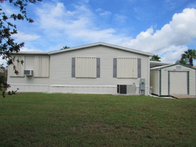 2005 Palm Harbor mobile home with a large (12x20) Florida room on Spanish Lakes Golf Village in Florida - for sale on GolfHomes.com, golf home, golf lot