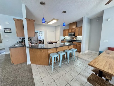 Welcome to your dream home at 3849 Saber Tooth Circle, nestled on Tiger Point Golf and Country Club in Florida - for sale on GolfHomes.com, golf home, golf lot