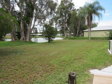 2005 Palm Harbor mobile home with a large (12x20) Florida room on Spanish Lakes Golf Village in Florida - for sale on GolfHomes.com, golf home, golf lot