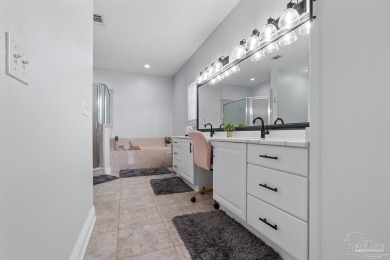 Welcome to your dream home at 3849 Saber Tooth Circle, nestled on Tiger Point Golf and Country Club in Florida - for sale on GolfHomes.com, golf home, golf lot