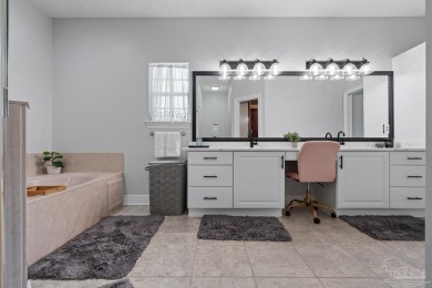Welcome to your dream home at 3849 Saber Tooth Circle, nestled on Tiger Point Golf and Country Club in Florida - for sale on GolfHomes.com, golf home, golf lot