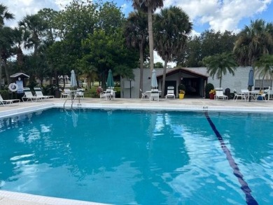 2005 Palm Harbor mobile home with a large (12x20) Florida room on Spanish Lakes Golf Village in Florida - for sale on GolfHomes.com, golf home, golf lot