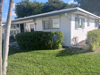Fall in love with this 2Br/2Ba corner villa is ideally located on Leisureville Community Golf Course in Florida - for sale on GolfHomes.com, golf home, golf lot