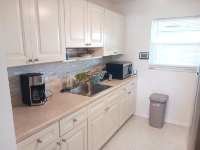 Fall in love with this 2Br/2Ba corner villa is ideally located on Leisureville Community Golf Course in Florida - for sale on GolfHomes.com, golf home, golf lot