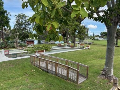 2005 Palm Harbor mobile home with a large (12x20) Florida room on Spanish Lakes Golf Village in Florida - for sale on GolfHomes.com, golf home, golf lot